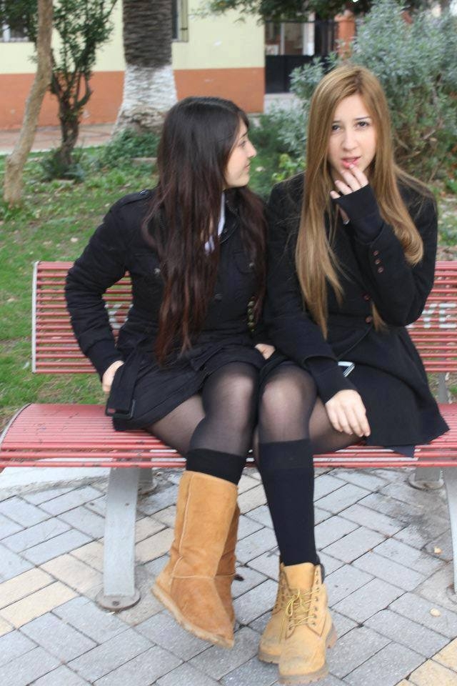 Two Schoolgirls wearing Black Sheer Pantyhose and Black Coats